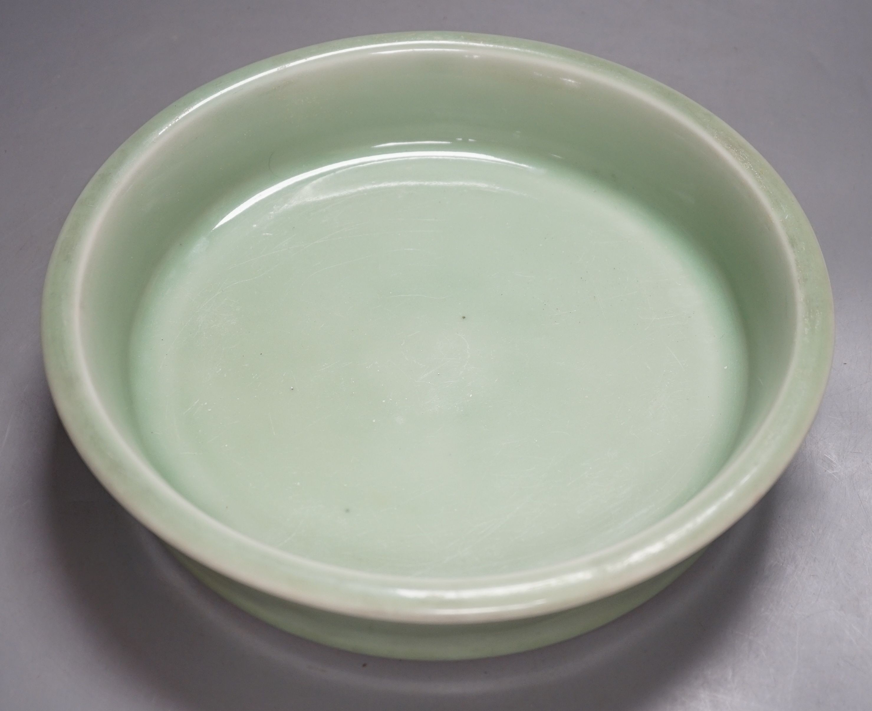 A Korean celadon glazed dish, 19th / 20th century-27 cms diameter.